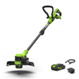 Green and black string trimmer with battery and charger on a white background